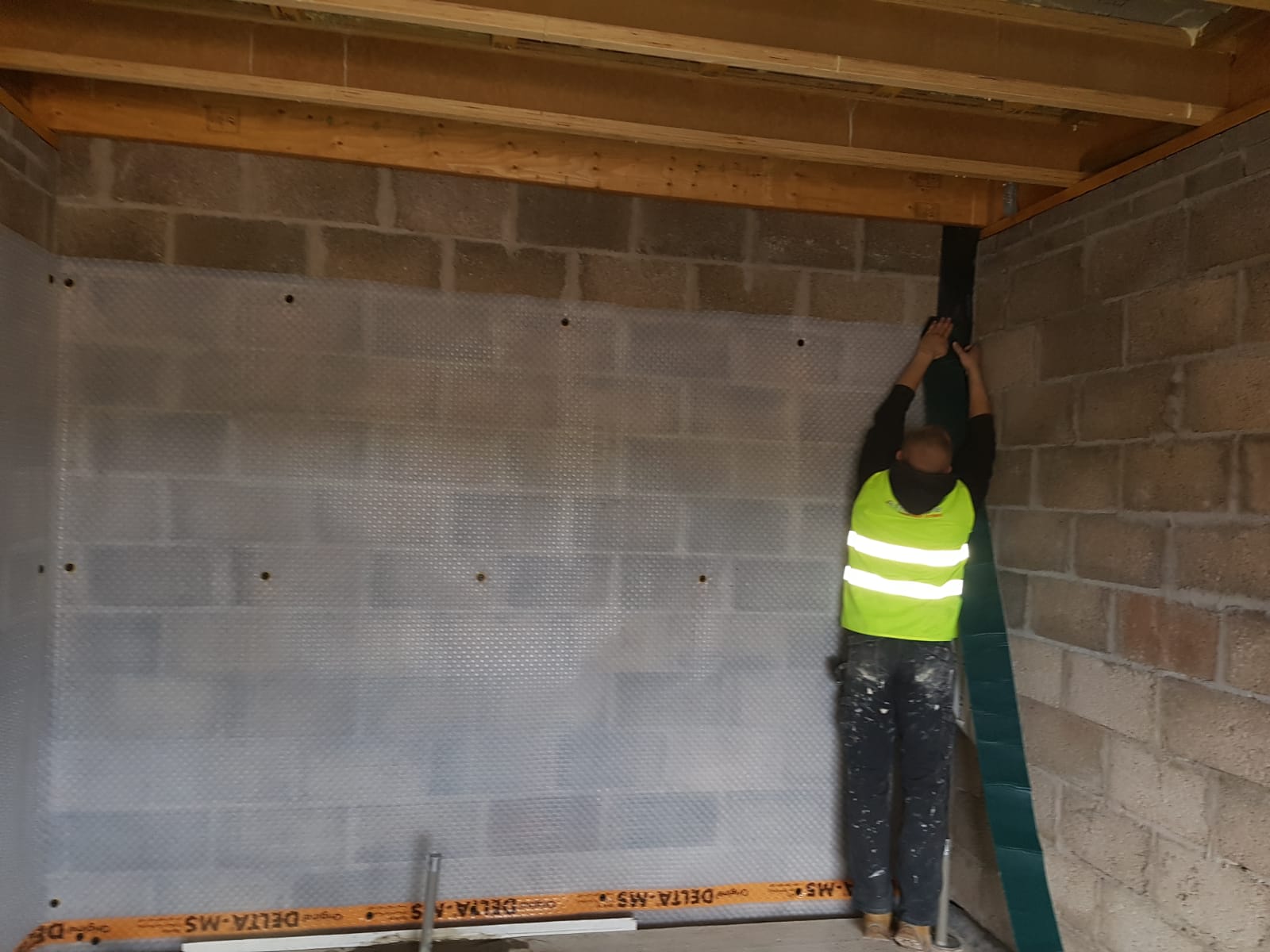 basement waterproofing work being carried out by our expert team